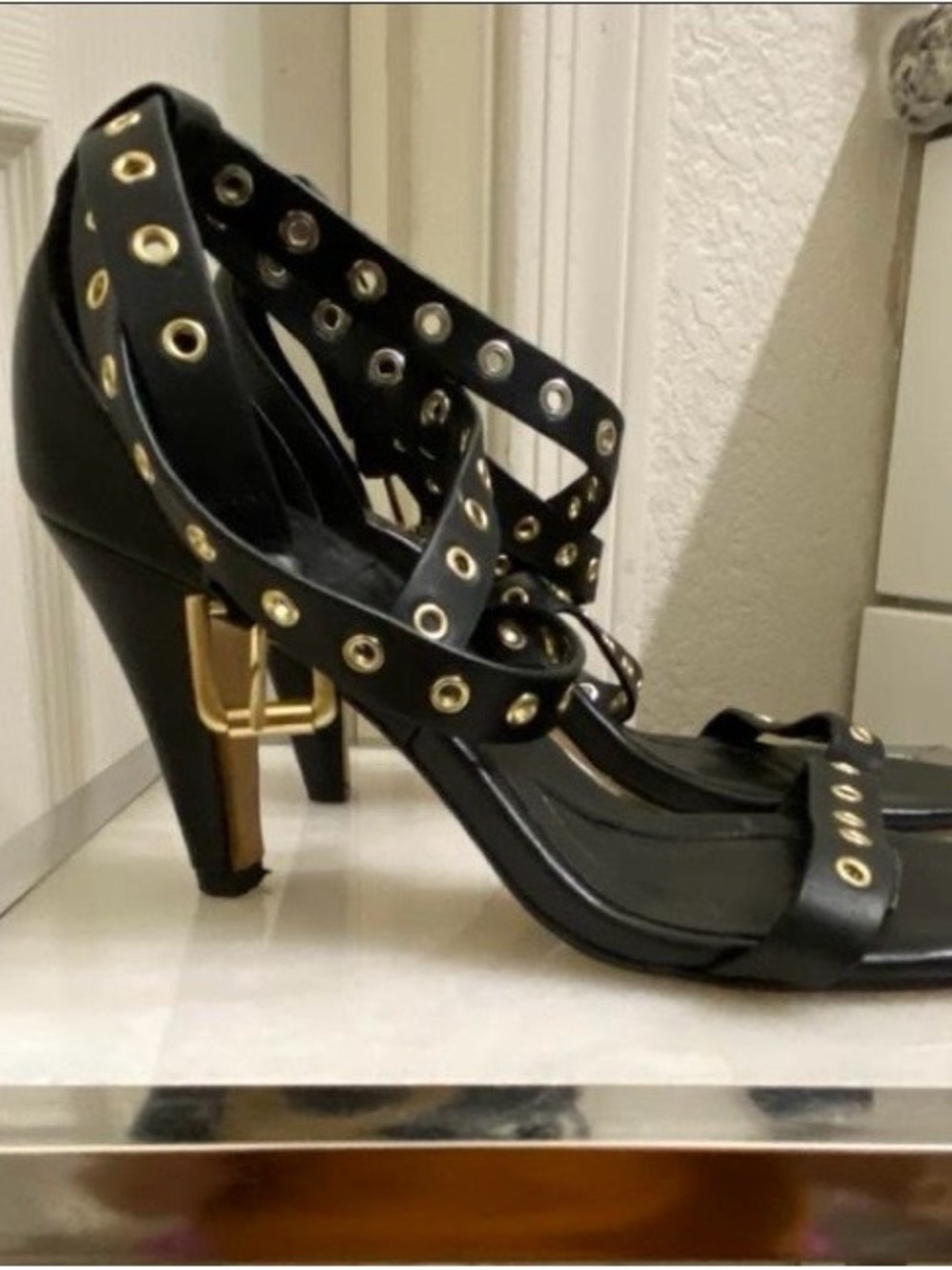 Isola Black Strappy Heels with Gold Grommet Details